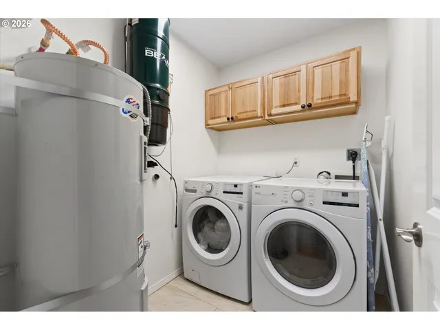 a utility room with dryer and washer