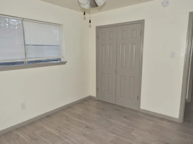 an empty room with a empty space and windows