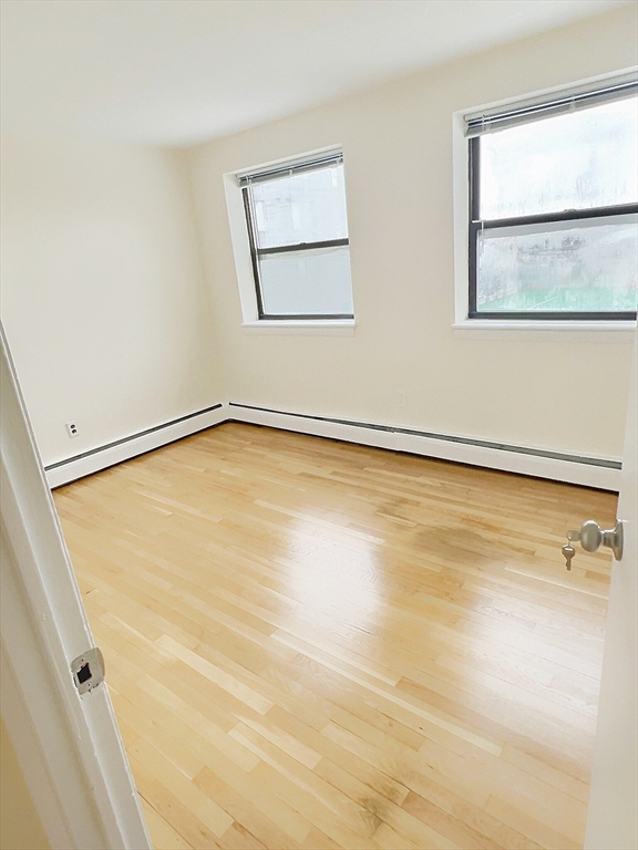 1039 Commonwealth Avenue, Unit 37 Boston, MA 02215 - Photo 6 of 7 an empty room with a window