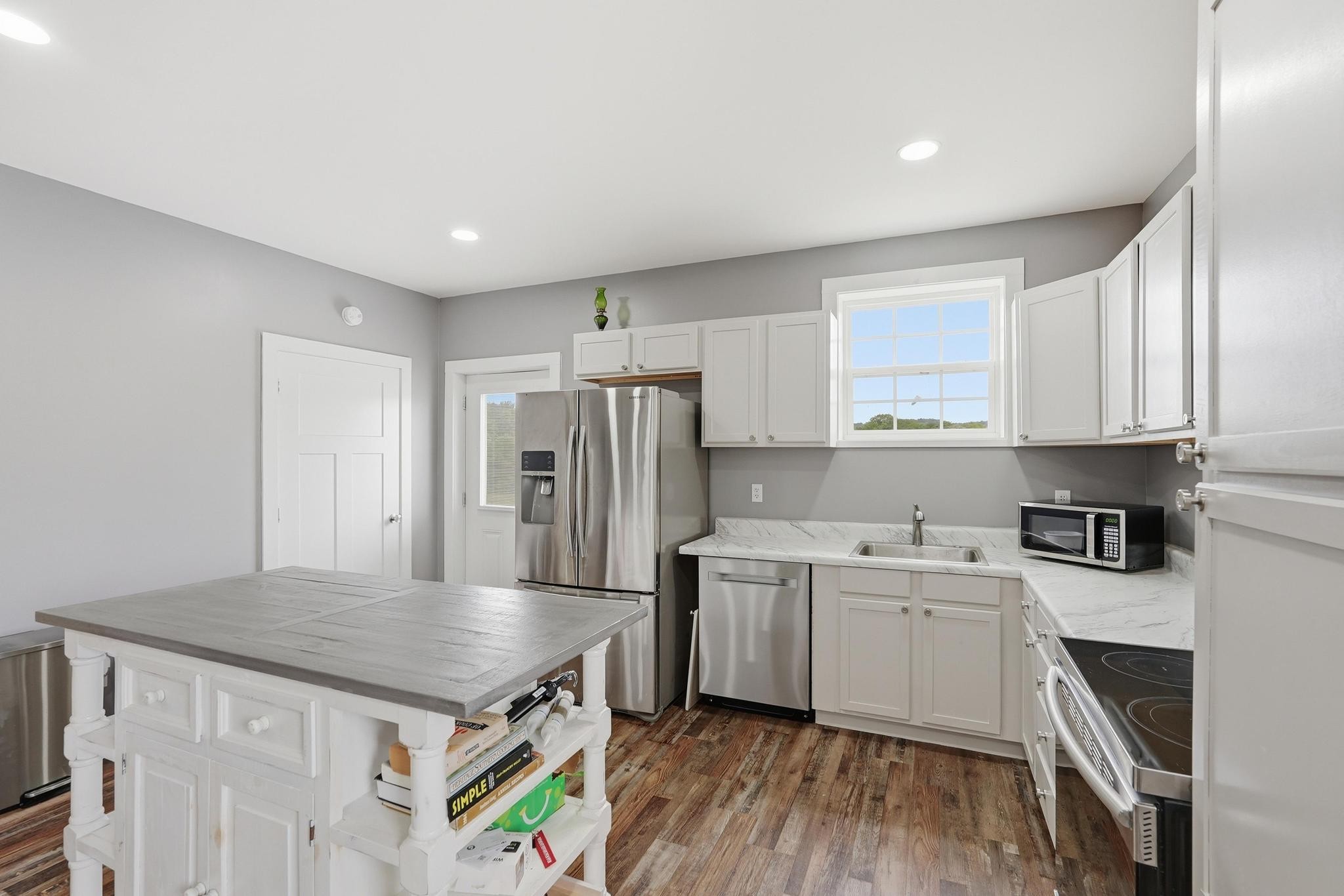 1050 Franks Ferry Road Sparta, TN 38583 - Photo 5 of 35 a kitchen with a sink a refrigerator and cabinets