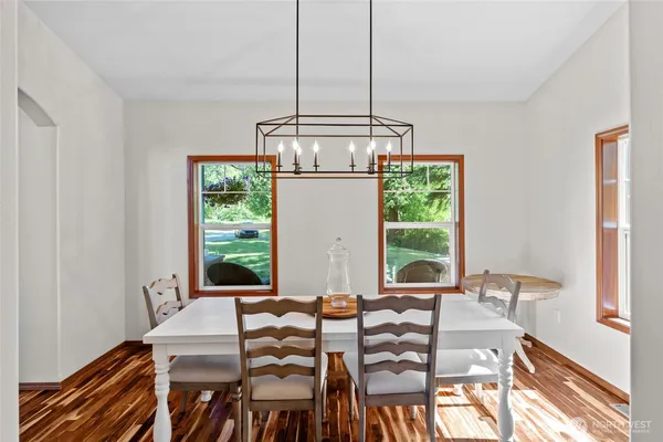 a view of a dining room with furniture window and outside view