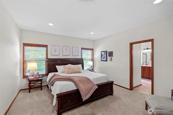 a bedroom with a bed and a night stand