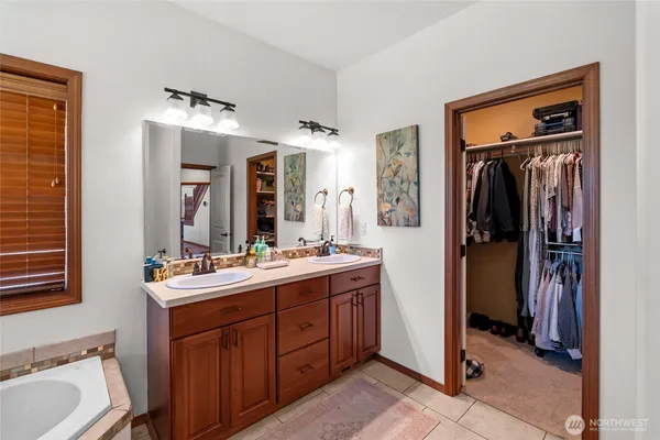 a bathroom with a sink vanity and mirror