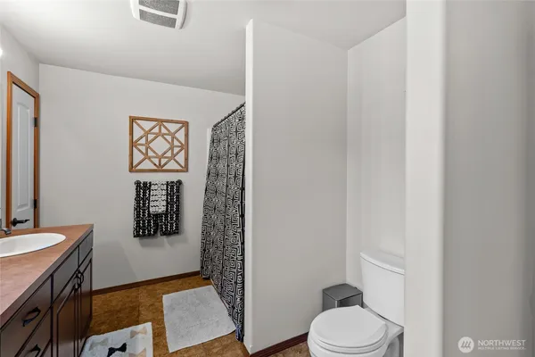 a bathroom with a toilet and a sink