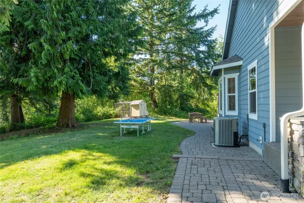 a backyard of a house with seating space