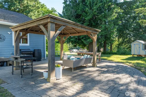 a view of a chair and table in the patio