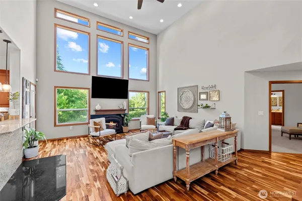 a living room with fireplace furniture and a flat screen tv