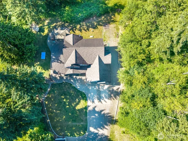 a backyard of a house with lots of green space