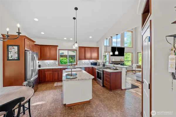 a kitchen with a sink stove and refrigerator