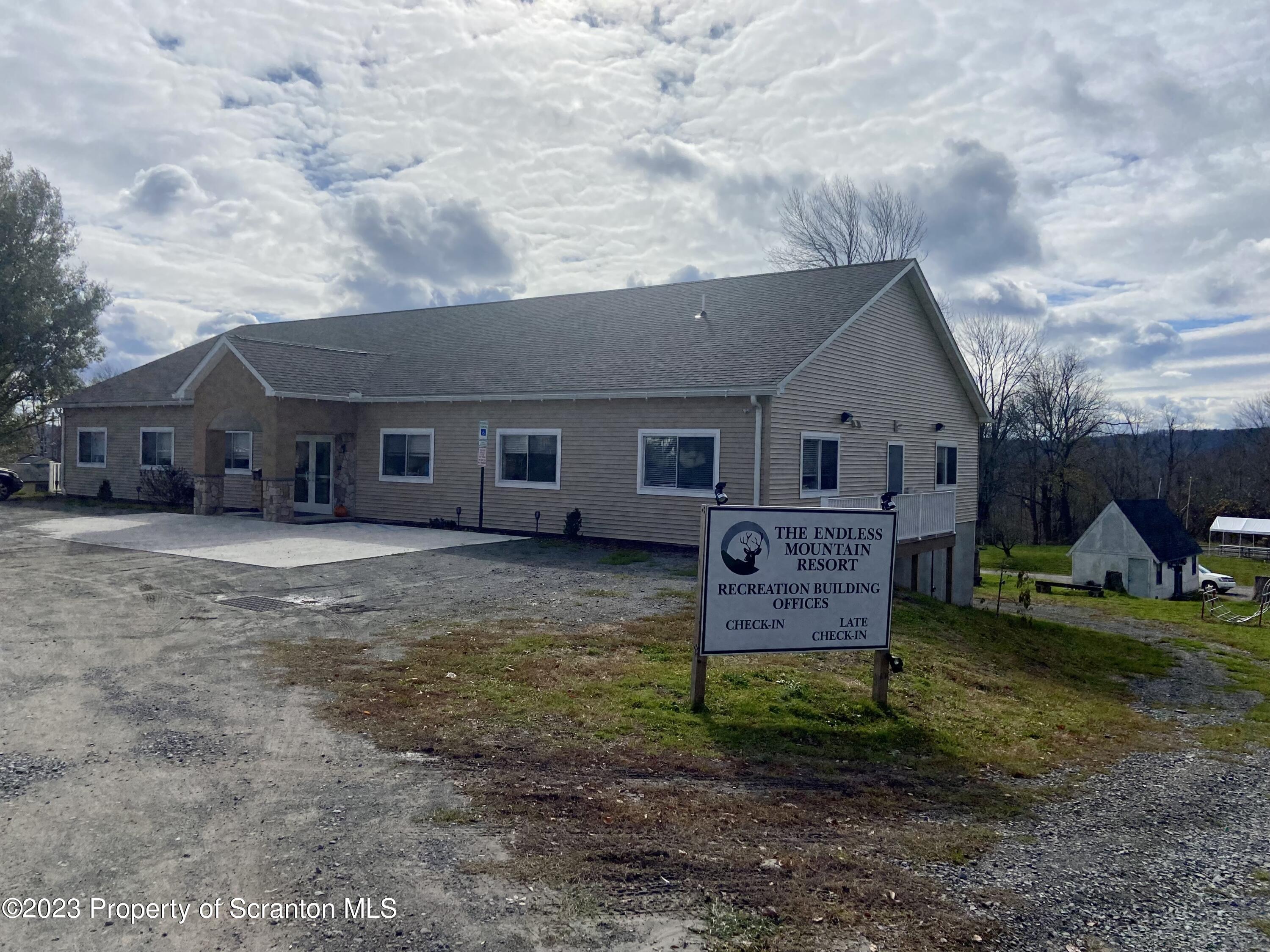 80 Garden Circle, Unit 20 Union Dale, PA 18470 - Photo 22 of 27 a view of a house with a yard