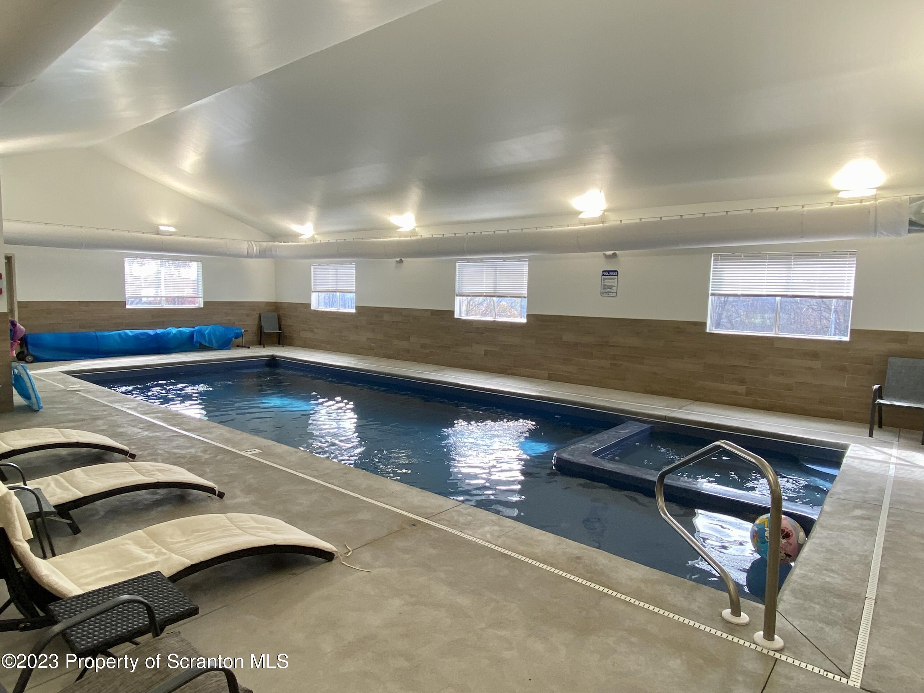 80 Garden Circle, Unit 20 Union Dale, PA 18470 - Photo 25 of 27 a view of a gym machines in room
