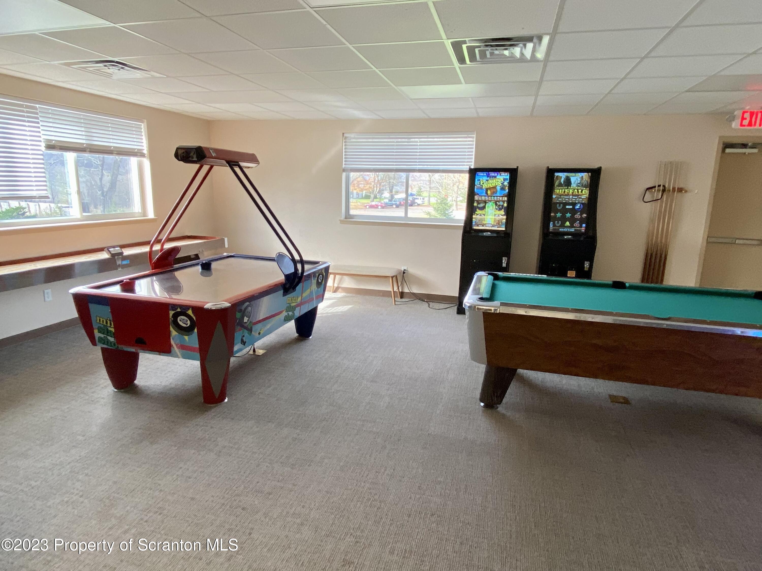 80 Garden Circle, Unit 20 Union Dale, PA 18470 - Photo 26 of 27 a living room with furniture and a table