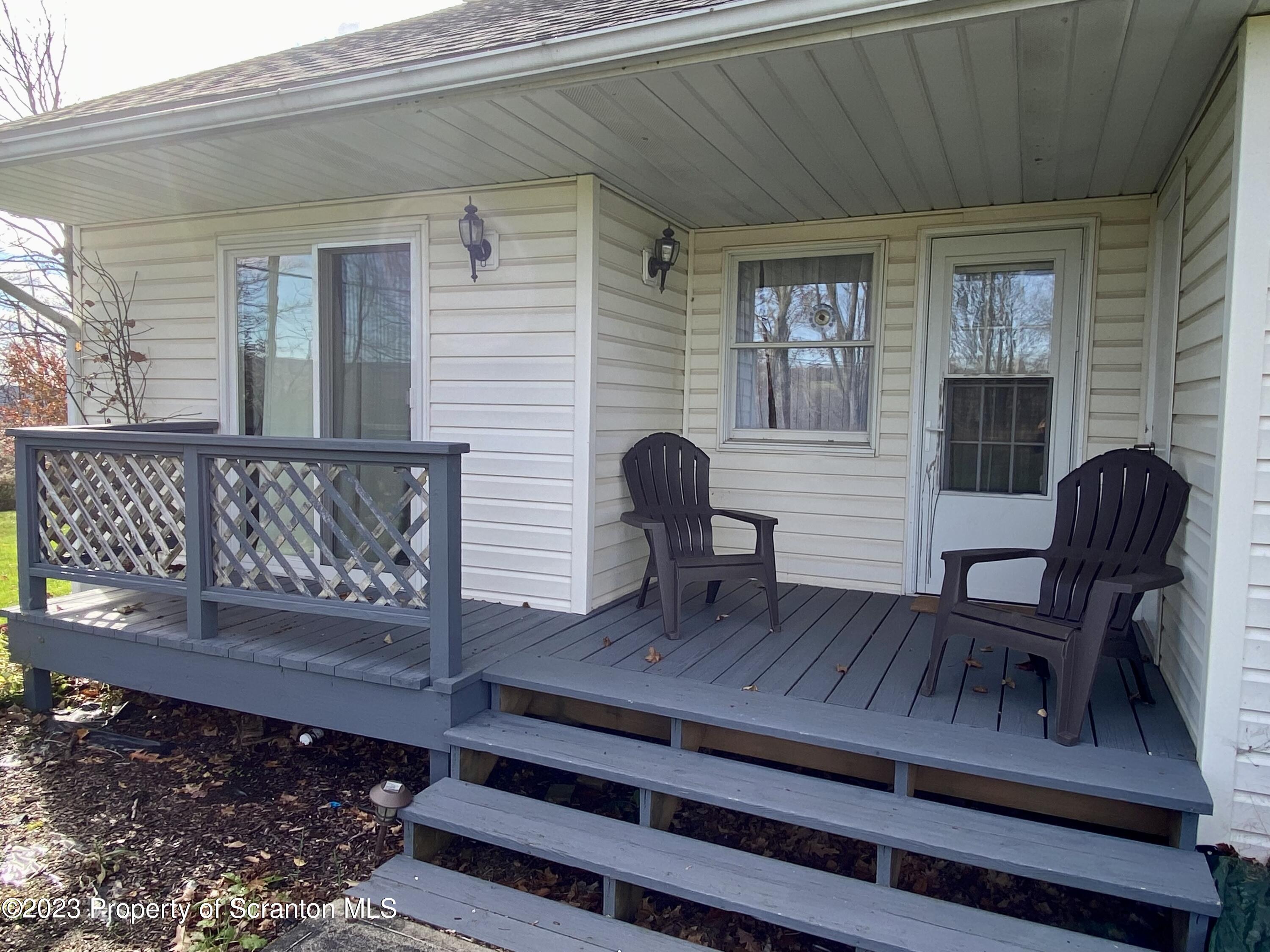 80 Garden Circle, Unit 20 Union Dale, PA 18470 - Photo 5 of 27 a view of wooden bench in balcony