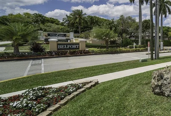 a view of backyard with outdoor seating and green space