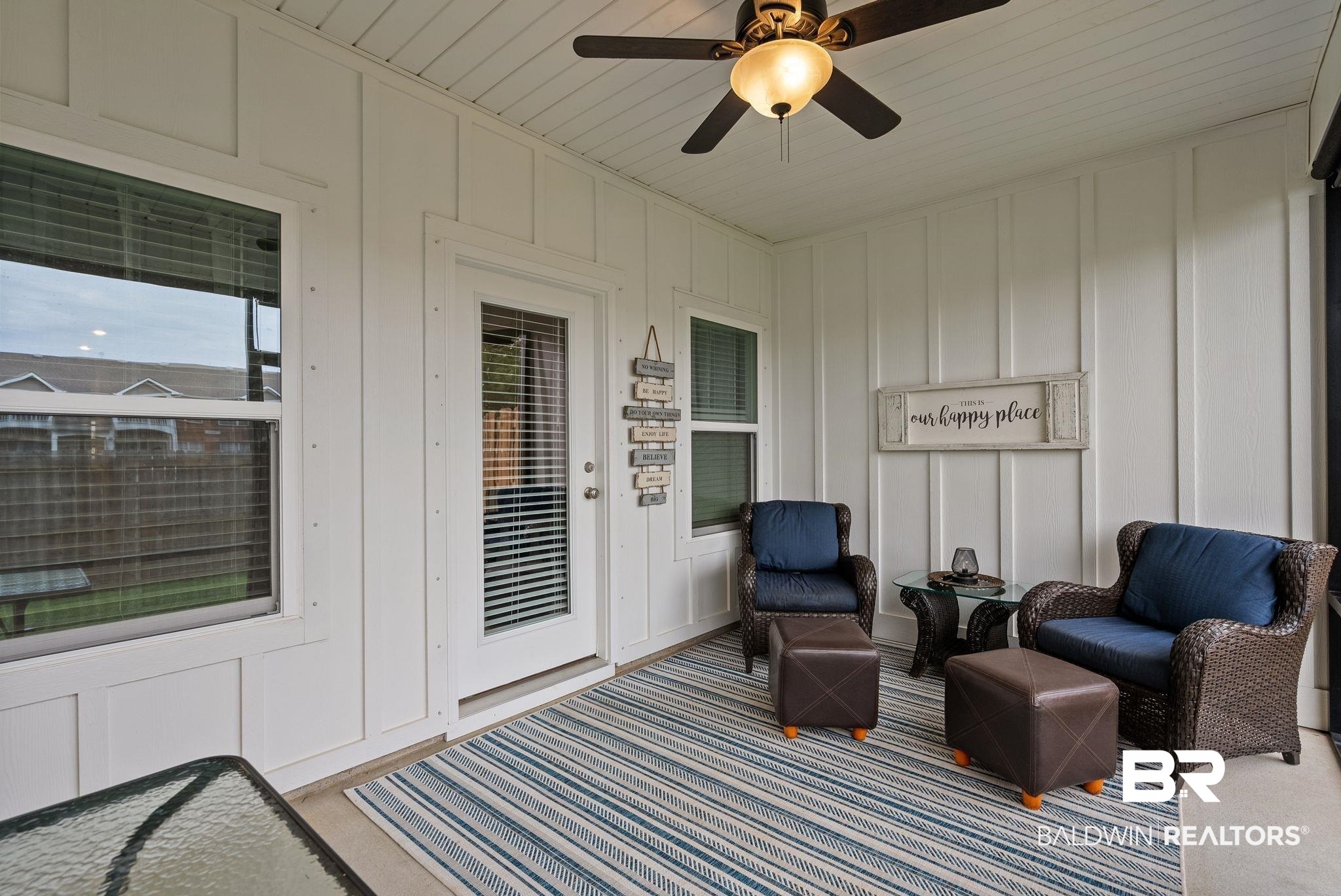 9899 Willet Way Foley, AL 36535 - Photo 29 of 37 Enclosed patio featuring white board-and-batten style walls, a ceiling fan with light fixture, and a glass-paneled exterior door