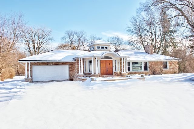 2S611 Arboretum Road Glen Ellyn, IL 60137 - Photo 1 of 25 a front view of a house with a yard and garage