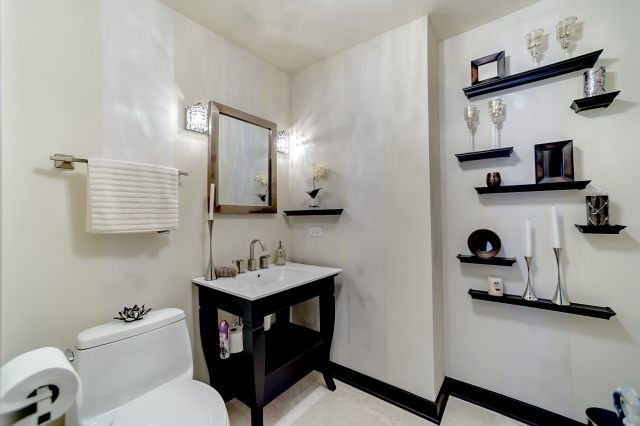 2S611 Arboretum Road Glen Ellyn, IL 60137 - Photo 12 of 25 a bathroom with a toilet sink and mirror