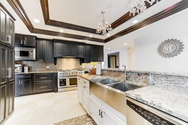 2S611 Arboretum Road Glen Ellyn, IL 60137 - Photo 14 of 25 a kitchen with stainless steel appliances granite countertop a sink stove and refrigerator