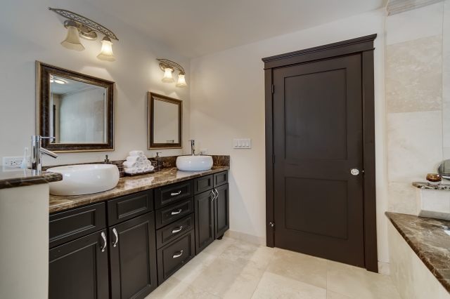 2S611 Arboretum Road Glen Ellyn, IL 60137 - Photo 18 of 25 a spacious bathroom with a granite countertop sink a mirror and a shower