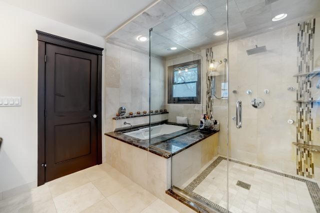 2S611 Arboretum Road Glen Ellyn, IL 60137 - Photo 19 of 25 a bathroom with a sink a mirror and a shower