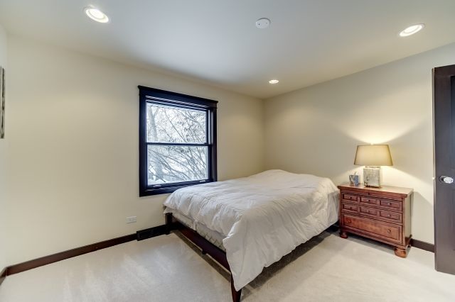 2S611 Arboretum Road Glen Ellyn, IL 60137 - Photo 20 of 25 a bedroom with a bed and a window