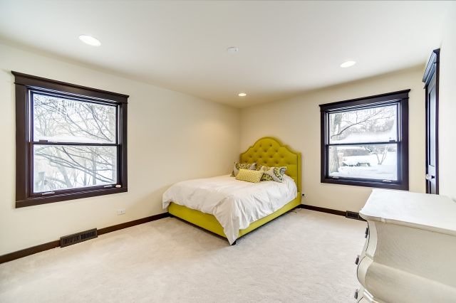 2S611 Arboretum Road Glen Ellyn, IL 60137 - Photo 21 of 25 a spacious bedroom with a bed and a window