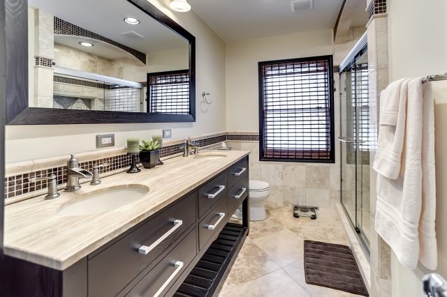 2S611 Arboretum Road Glen Ellyn, IL 60137 - Photo 22 of 25 a bathroom with a double vanity sink a mirror and a bathtub