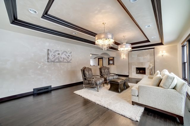 2S611 Arboretum Road Glen Ellyn, IL 60137 - Photo 9 of 25 a living room with fireplace furniture and a chandelier