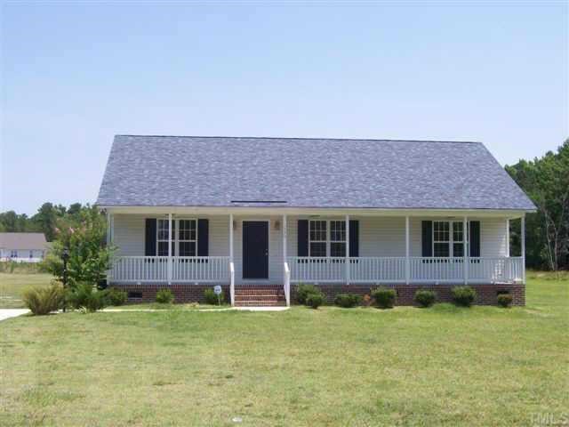 1530 Cleveland Road Smithfield, NC 27577 - Photo 1 of 10 PRETTY little home with ROCKING CHAIR front porch and ceiling fans to keep you cool!!