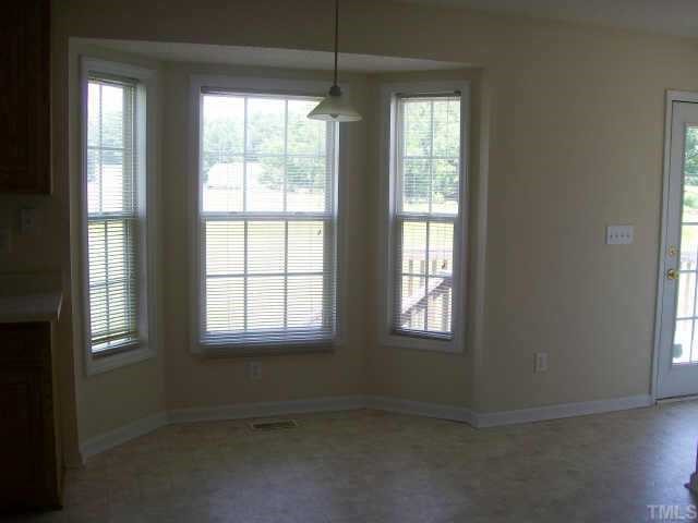 1530 Cleveland Road Smithfield, NC 27577 - Photo 4 of 10 This Dining Nook is ROOMY and has a LOVELY BAY window that lends to a light and airy feel! To the right of this room is a very short alcove. You may access the back deck and the UTILITY closet from the alcove!
