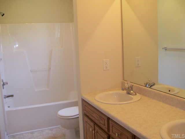 1530 Cleveland Road Smithfield, NC 27577 - Photo 6 of 10 This Master Bath has DOUBLE sinks, formica counter tops, a vinyl floor, a TUB/SHOWER combo, and a LARGE walk-in closet!