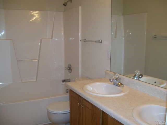1530 Cleveland Road Smithfield, NC 27577 - Photo 10 of 10 This is a GREAT 2nd bathroom for a home this size! DOUBLE sinks with formica counter tops, vinyl flooring, and a TUB/SHOWER combo!