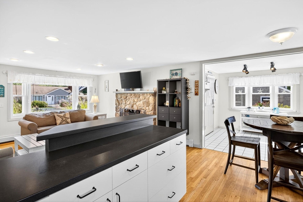 31 Easy Street Dennis, MA 02639 - Photo 11 of 41 a living room with fireplace furniture and a flat screen tv