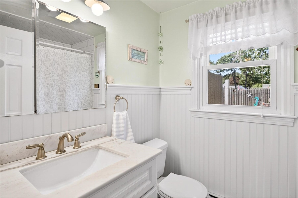 31 Easy Street Dennis, MA 02639 - Photo 19 of 41 a bathroom with a sink a mirror and a toilet