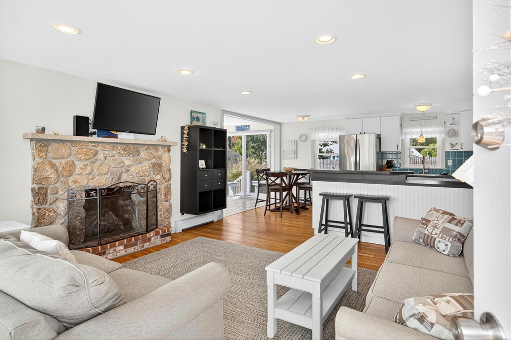 31 Easy Street Dennis, MA 02639 - Photo 2 of 41 a living room with furniture and a flat screen tv