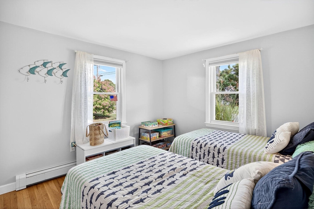 31 Easy Street Dennis, MA 02639 - Photo 21 of 41 a bedroom with two beds and a window