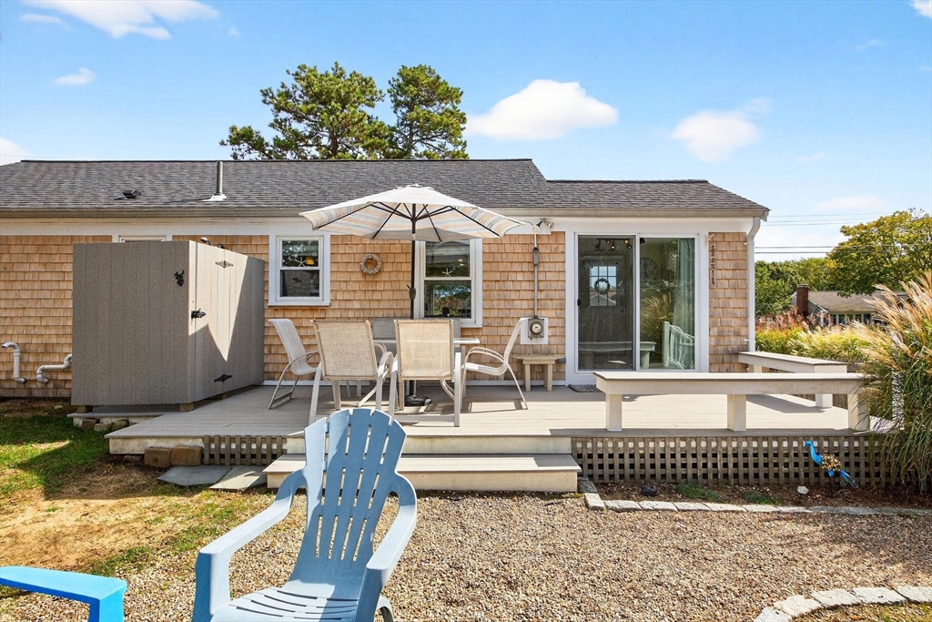31 Easy Street Dennis, MA 02639 - Photo 26 of 41 a view of a house with backyard and sitting area