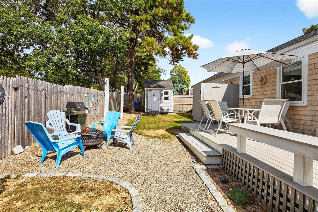 31 Easy Street Dennis, MA 02639 - Photo 30 of 41 a view of a house with backyard and sitting area