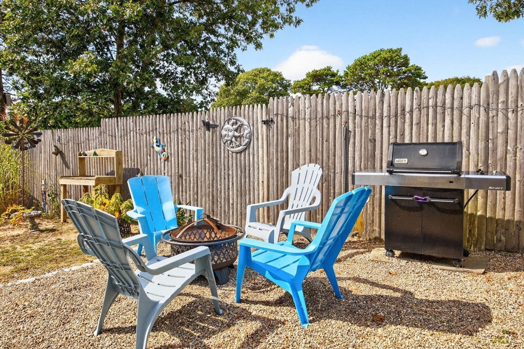 31 Easy Street Dennis, MA 02639 - Photo 33 of 41 a view of a chairs and bench in the terrace