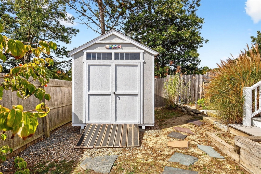 31 Easy Street Dennis, MA 02639 - Photo 36 of 41 a front view of a house with a yard