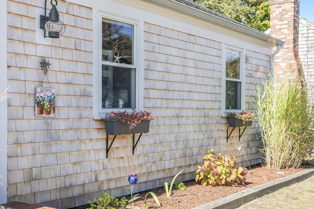 31 Easy Street Dennis, MA 02639 - Photo 39 of 41 a bathroom with a sink and a mirror