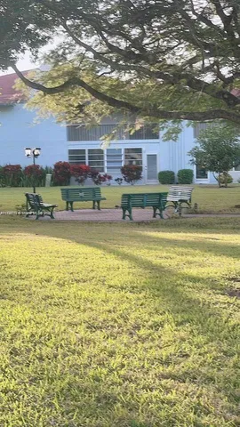 a outdoor space with furniture a window and a rug
