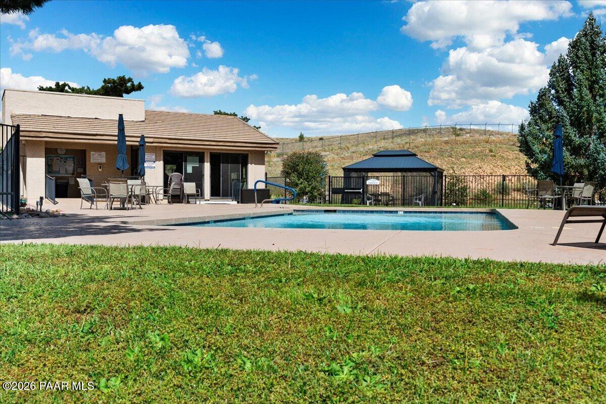 2180 Resort Way South, Unit A7 Prescott, AZ 86301 - Photo 23 of 27 a front view of a house with a yard