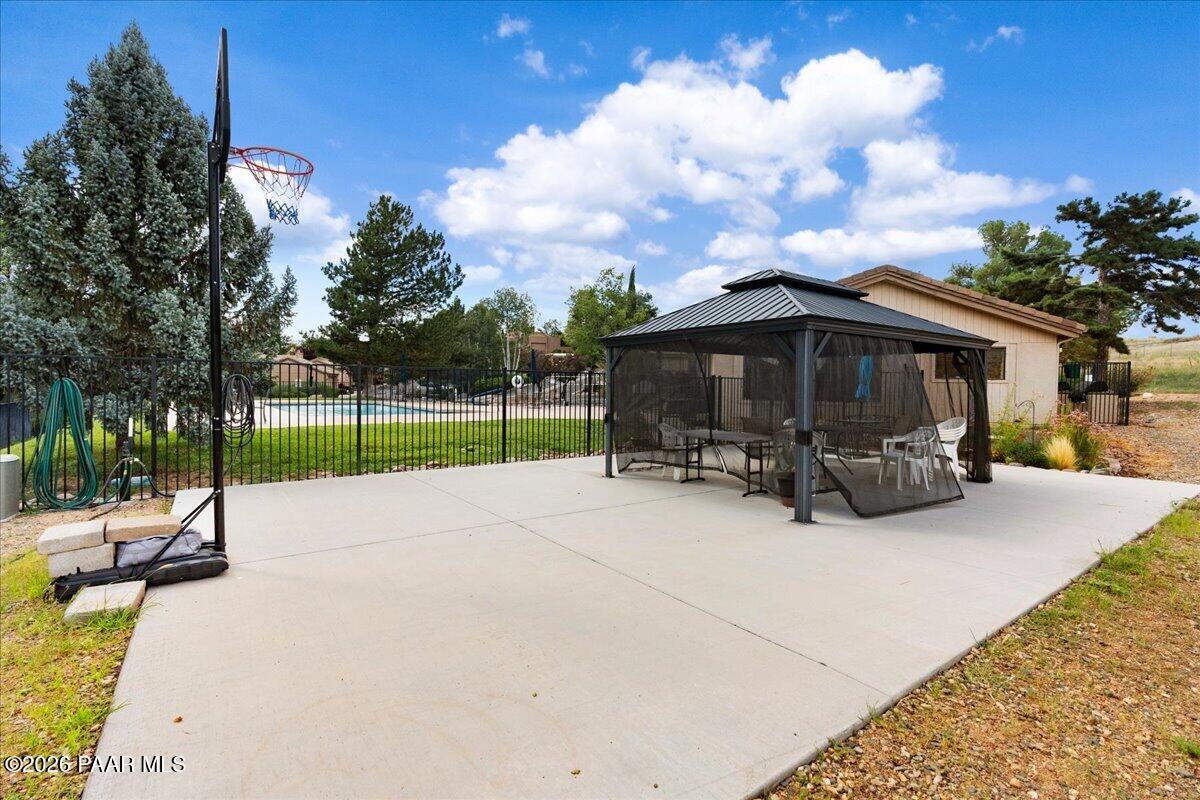 2180 Resort Way South, Unit A7 Prescott, AZ 86301 - Photo 26 of 27 a view of a house with backyard and sitting area
