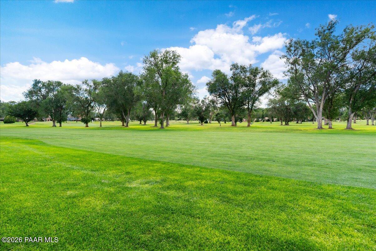 2180 Resort Way South, Unit A7 Prescott, AZ 86301 - Photo 27 of 27 a view of a grassy field with trees