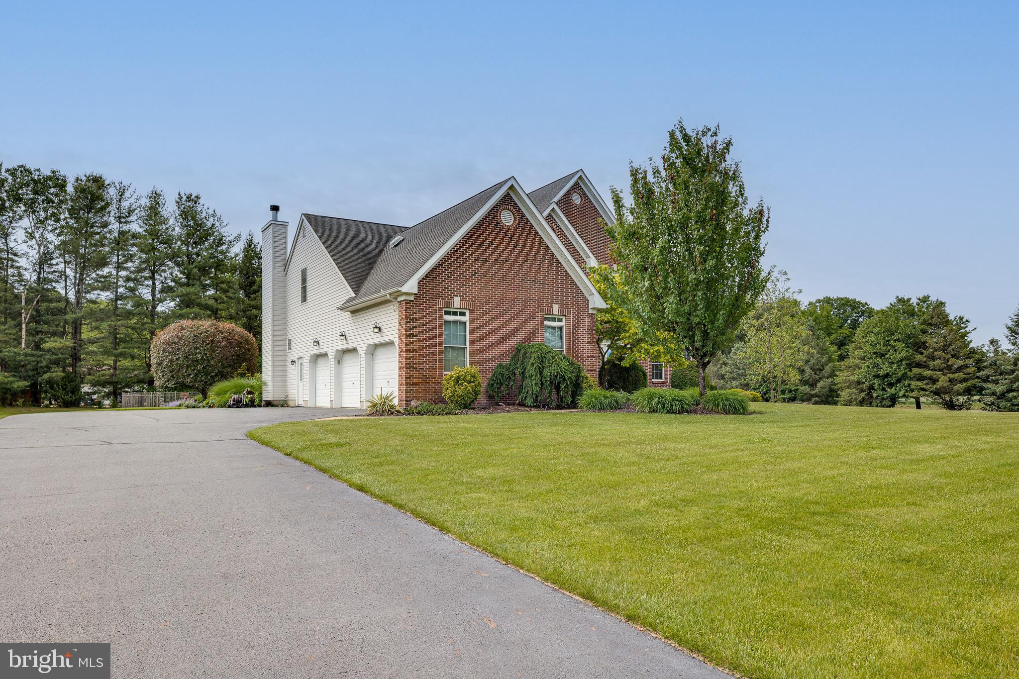 2 Dellaira Court Wrightstown, NJ 08562 - Photo 3 of 93 a front view of a house with a yard and garage