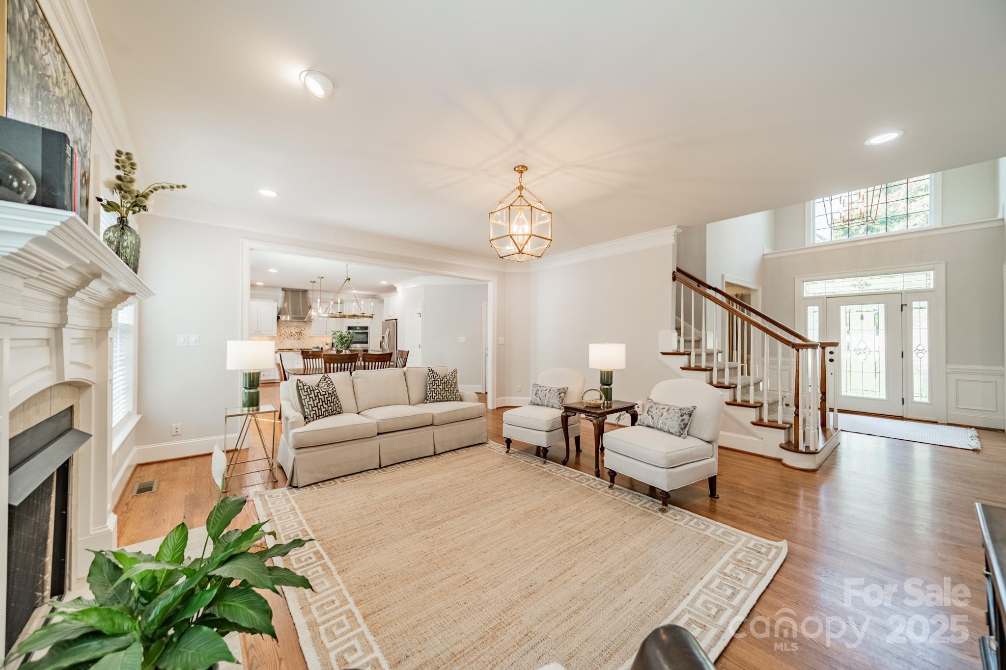 788 Portpatrick Place Fort Mill, SC 29708 - Photo 11 of 48 a living room with furniture and a chandelier