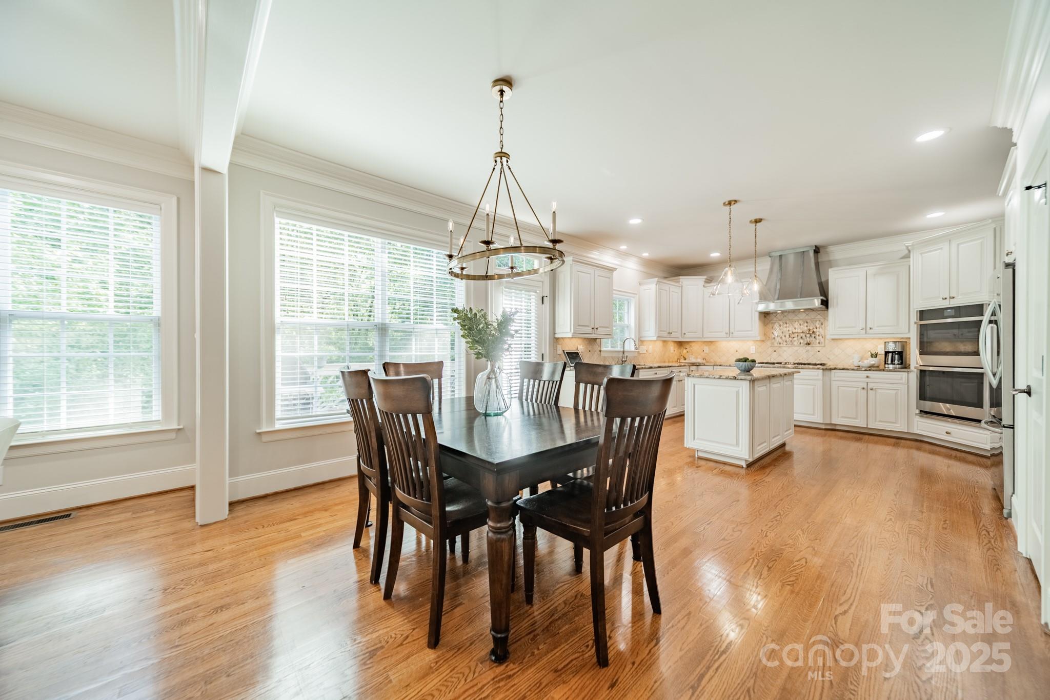 788 Portpatrick Place Fort Mill, SC 29708 - Photo 12 of 48 a view of a dining room with furniture window and wooden floor
