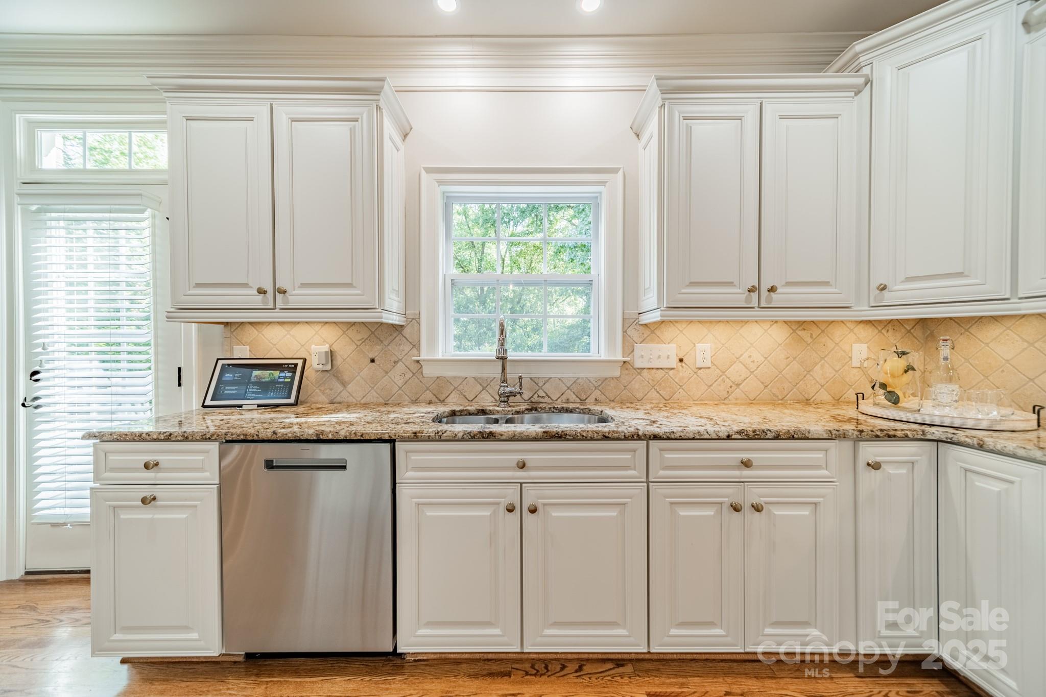 788 Portpatrick Place Fort Mill, SC 29708 - Photo 16 of 48 a kitchen with granite countertop cabinets and window