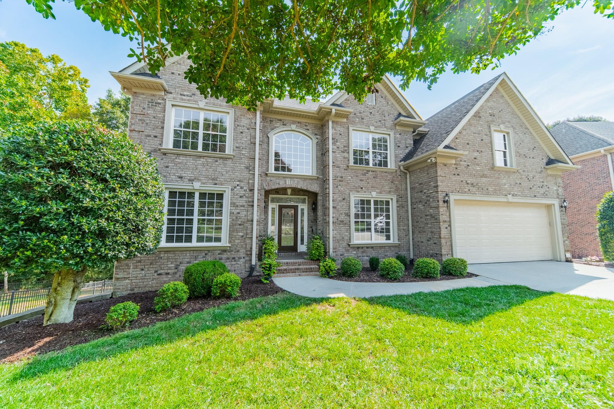 788 Portpatrick Place Fort Mill, SC 29708 - Photo 2 of 48 a front view of a house with a garden and plants